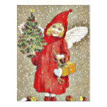 A girl dressd with santa claus with wings and gift post card
