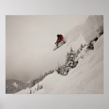 A snowboarder jumps off a cliff into powder in poster