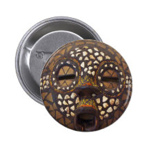 African mask with cowrie shells pin
