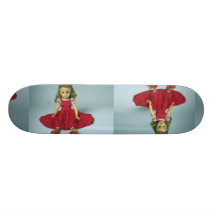 Baby girl doll dressed in red skate decks