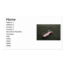 Beach pollution broken doll leg on sand business card template