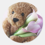 bear holding calla lilies round sticker