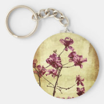 Beautifu magnolia on grunge background key chain