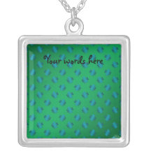 Blue shamrocks on green background pendants
