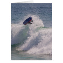 Body boarder riding a big wave cards