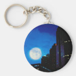 City at night with moon key chains