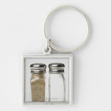 Close-up of a salt and a pepper shaker key chain