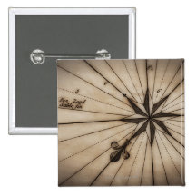 Close up of wind rose on antique map pin