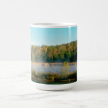 coffee mug with mist on a pond