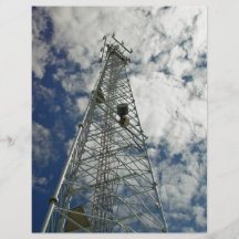 Communications tower reaching for the clouds flyer