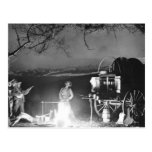 Cowboys playing and singing around a campfire post cards