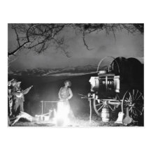 Cowboys playing and singing around a campfire post cards