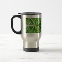 Cream patterns on green leaf coffee mug