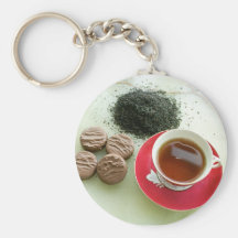 Cup of black tea with chocolate biscuits key chains
