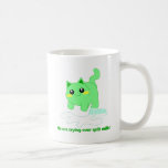 Cute kitten with spilt milk coffee mugs