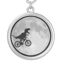 Dinosaur on a bike moon pendants