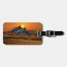 Dolphins at sunset luggage tag
