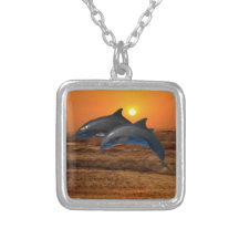 Dolphins at sunset pendant