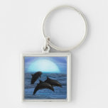 Dolphins playing at moonlight keychain