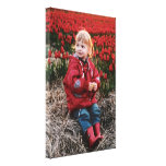 Dutch Girl in Red Tulip Field Canvas Print