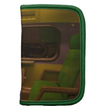 Empty Seats on Night Train - green yellow photo Organizers