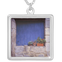 Europe, France, Cereste. A blue door adds colour Custom Jewelry