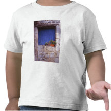 Europe, France, Cereste. A blue door adds colour Shirts