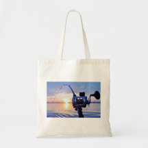 Fishing Reel at Sunset Canvas Bags