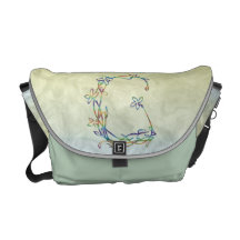 FLORAL MONOGRAM G COURIER BAGS