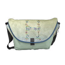 FLORAL MONOGRAM H COURIER BAG
