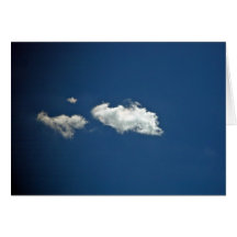 Fluffy white cloud on deep blue sky greeting card