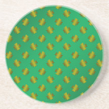 Gold shamrocks on green coaster