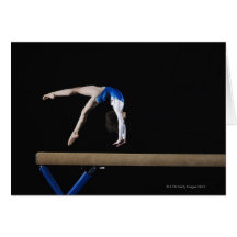 Gymnast (9-10) flipping on balance beam, side greeting card