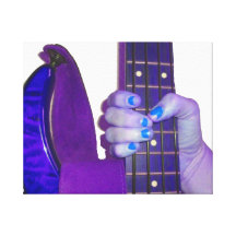 Hand holding bass guitar blue and purple photo stretched canvas print
