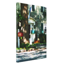 Home With Turquoise Shutters Stretched Canvas Print