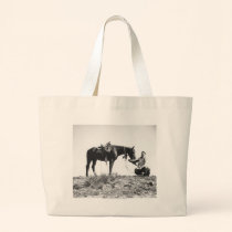 Horse eating from a cowboy's hat. bags