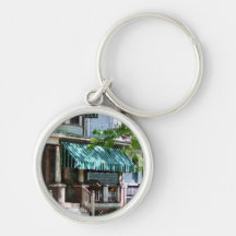 House With Green Striped Awning Key Chain