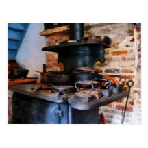 Irons Heating on Stove Postcard
