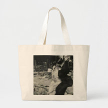 Kissing on the stone wall tote bags