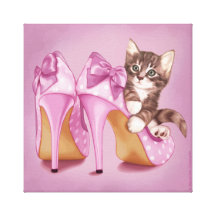 Kitten in purple shoe stretched canvas prints
