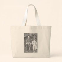 Larry Larom and a women posing. bags