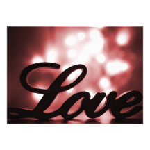 Love sign with red sparkle lights behind personalized invites