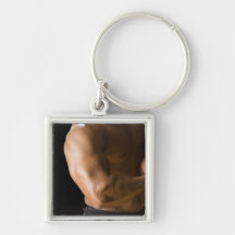 Male bodybuilder flexing muscles, front view, 2 key chains