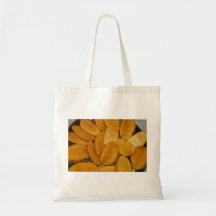 Mango slices tote bags