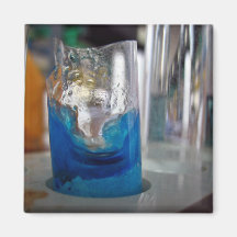 Melted glass vessel with solution fridge magnets