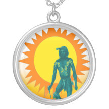 Native Aboriginal in front of a gold sun Necklace