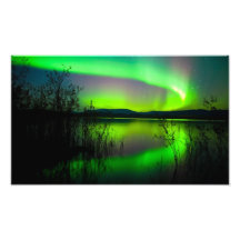 Northern lights mirrored on lake photo