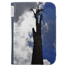 Old dead tree against dark cloudy sky kindle cover