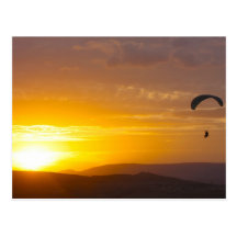 Paragliding on the sunset postcards