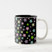 Pastel stars pattern on black coffee mugs